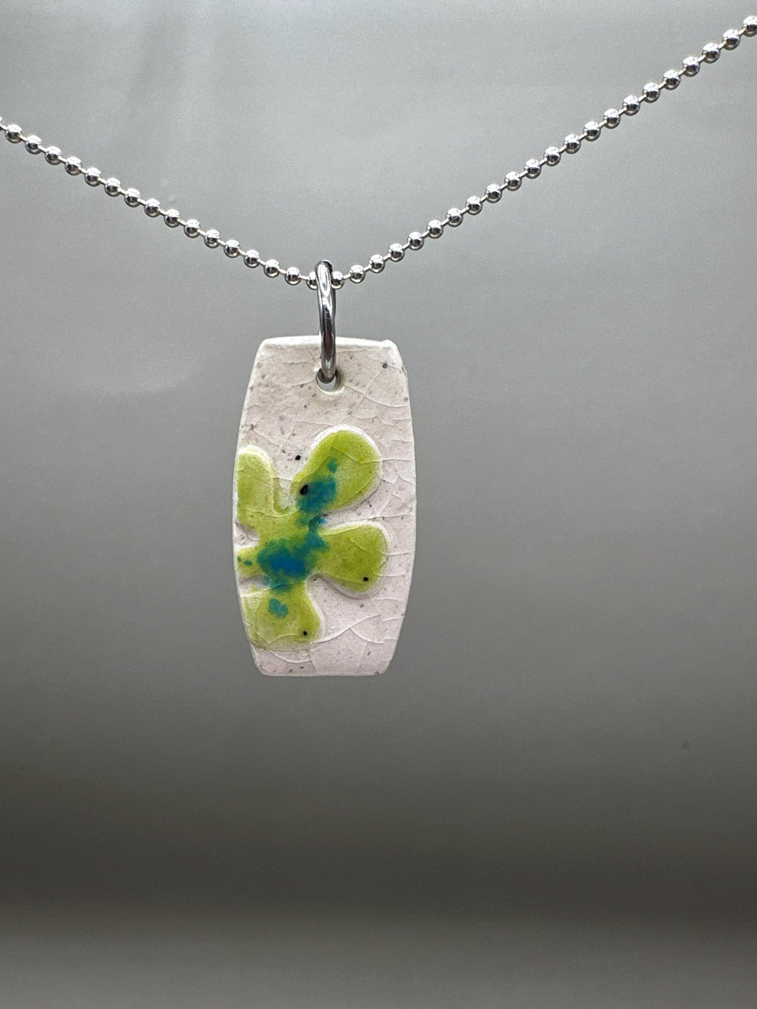 green flower pendant