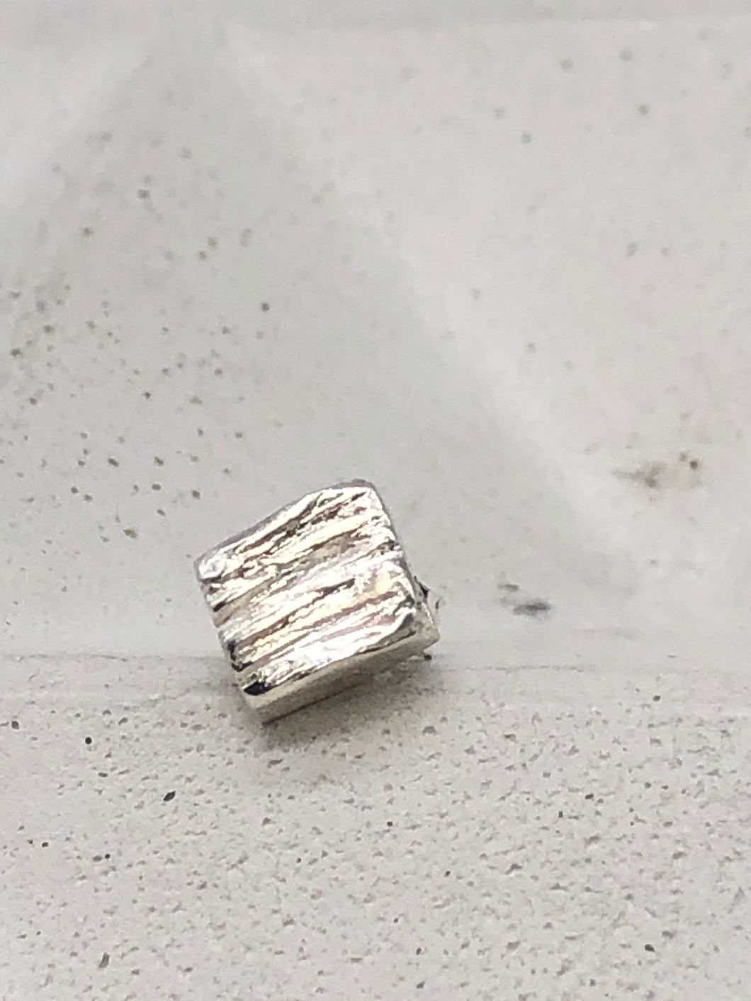 square silver textured stud