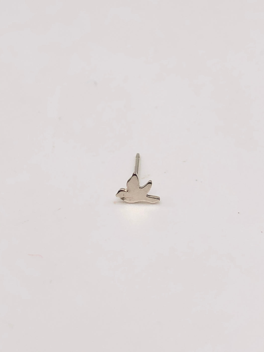 tiny silver bird stud earring.