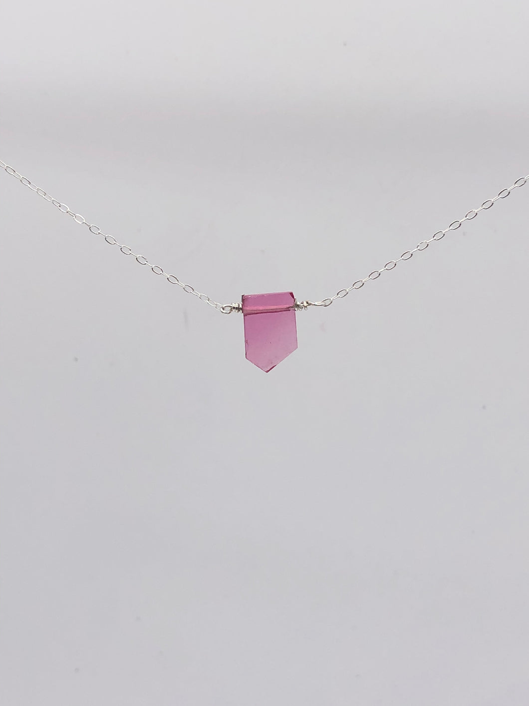 pink tourmaline pendant on silver chain