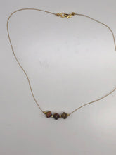 Load image into Gallery viewer, gold cord necklace with gold and copper glass beads
