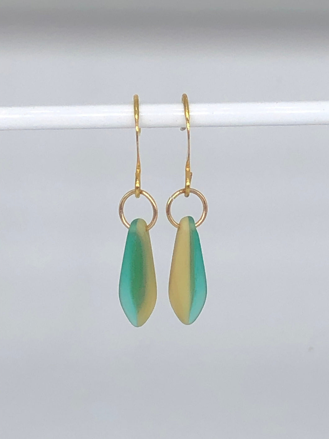 green and cream earrings