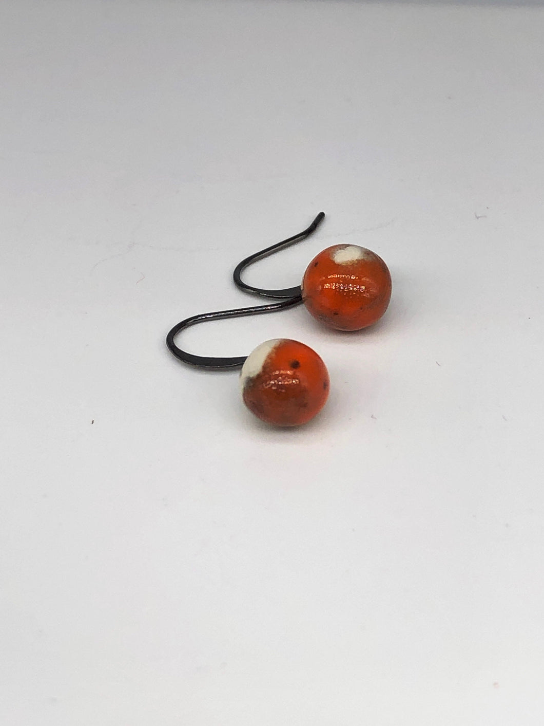 orange and white spotted ceramic drop earrings