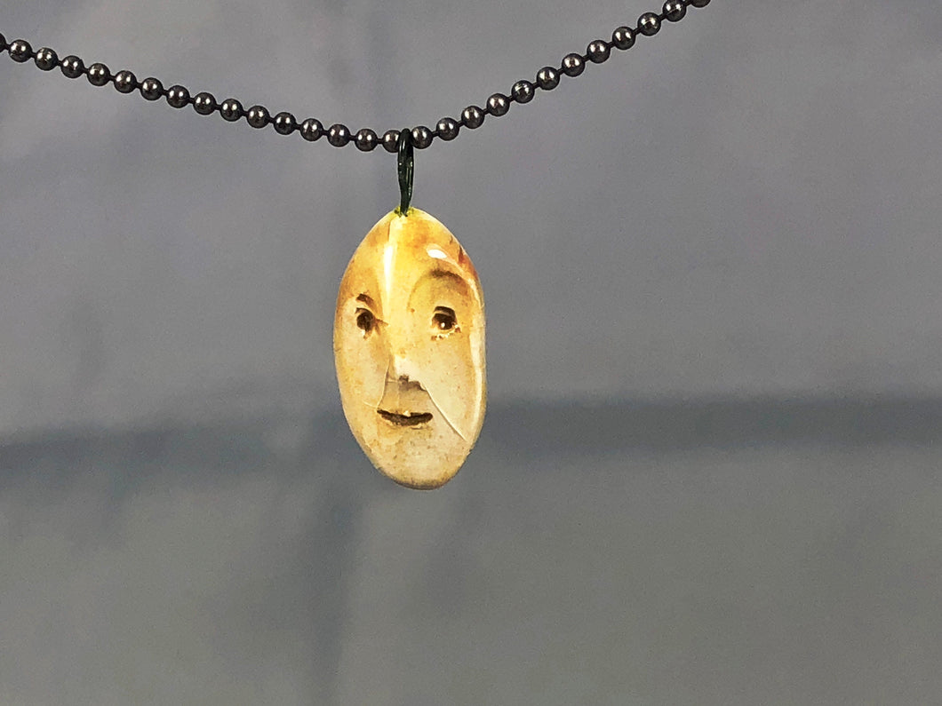 ceramic face pendant B