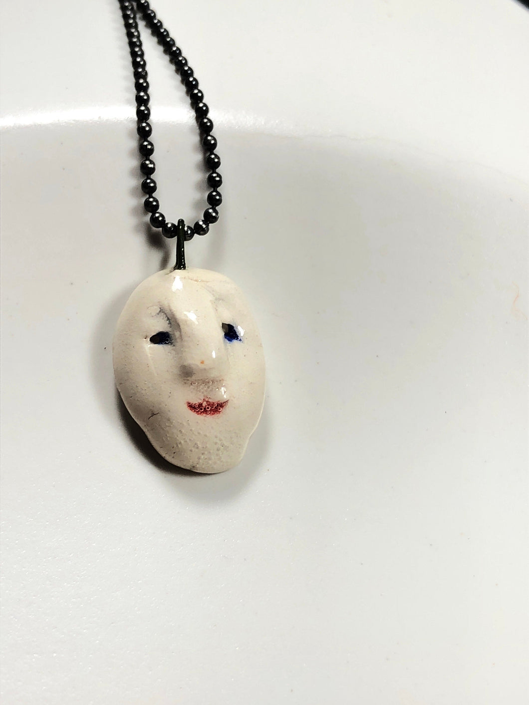 ceramic face pendant D