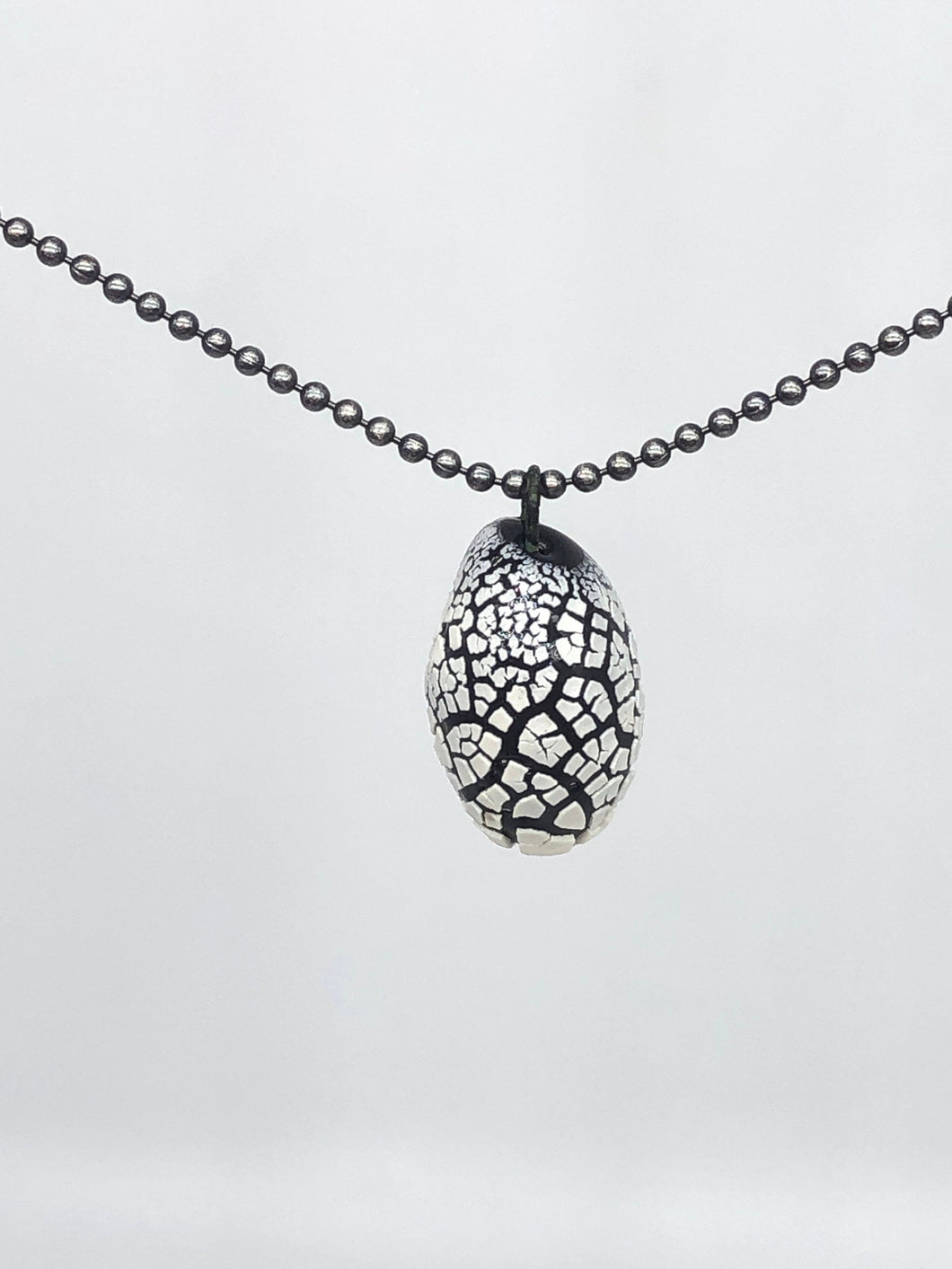 white on black crackle pendant