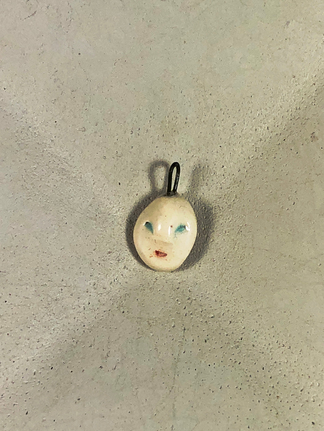 ceramic face pendant F