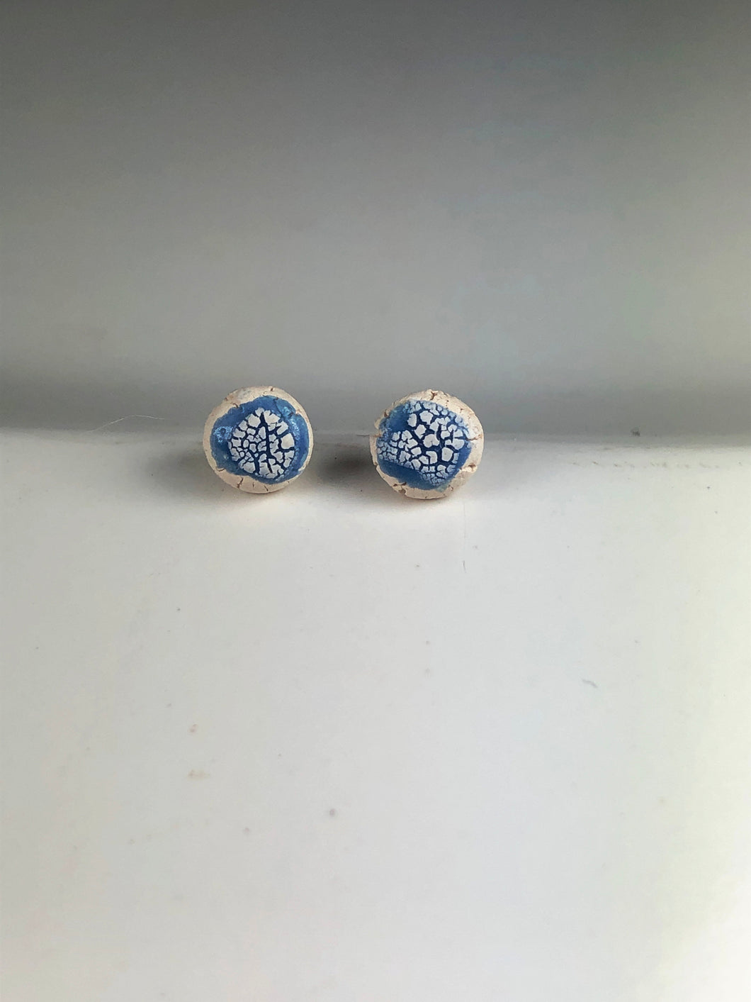 blue on white clay crackle studs