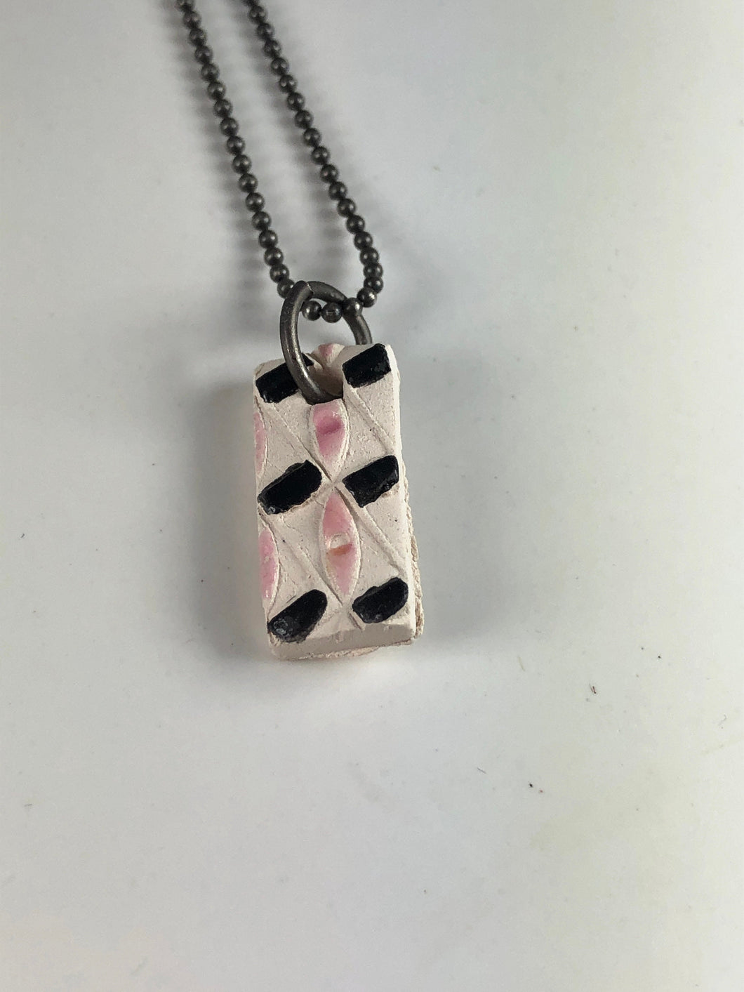 pink and black on white pendant