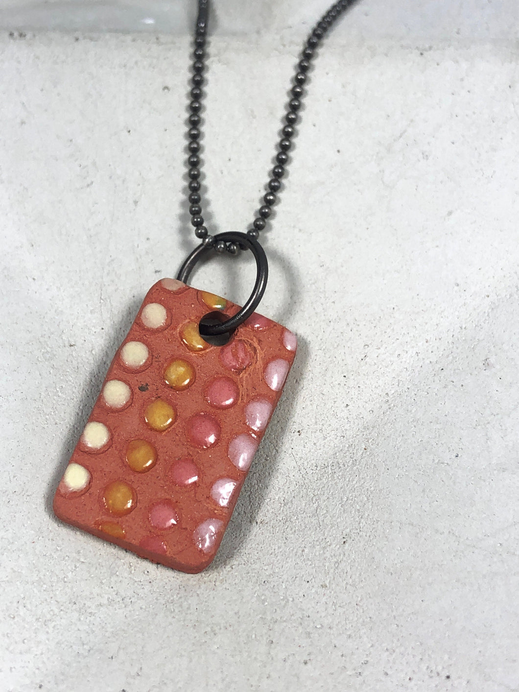 pink and yellow dot pendant