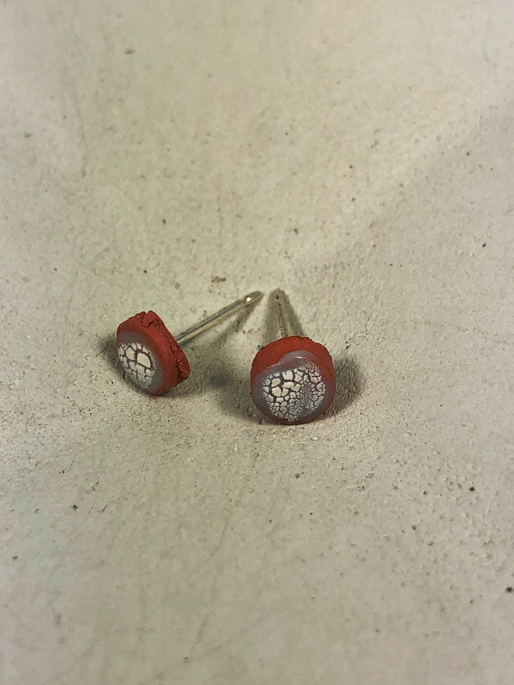 white and gray on red clay crackle studs