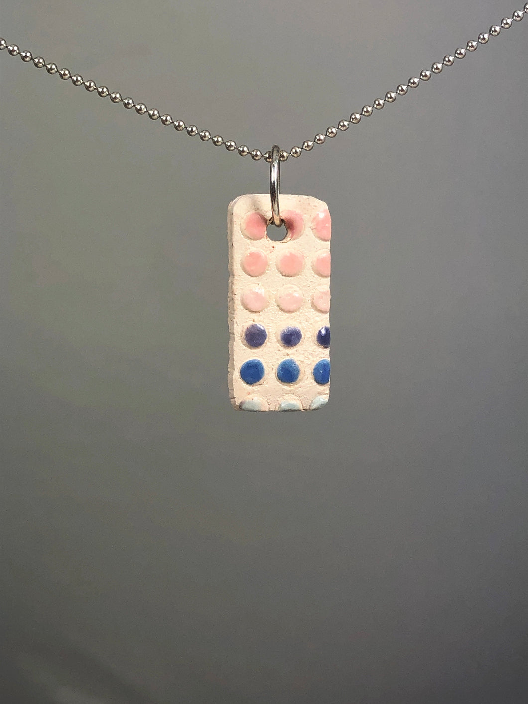 pink and blue dot pendant