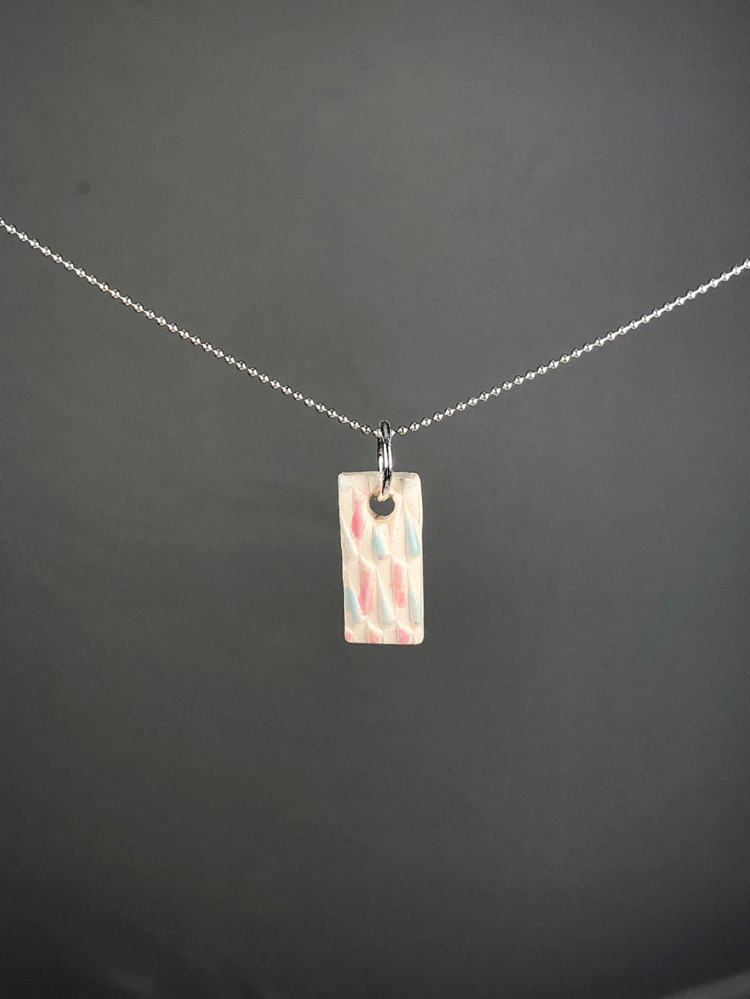 pink and blue on white pendant