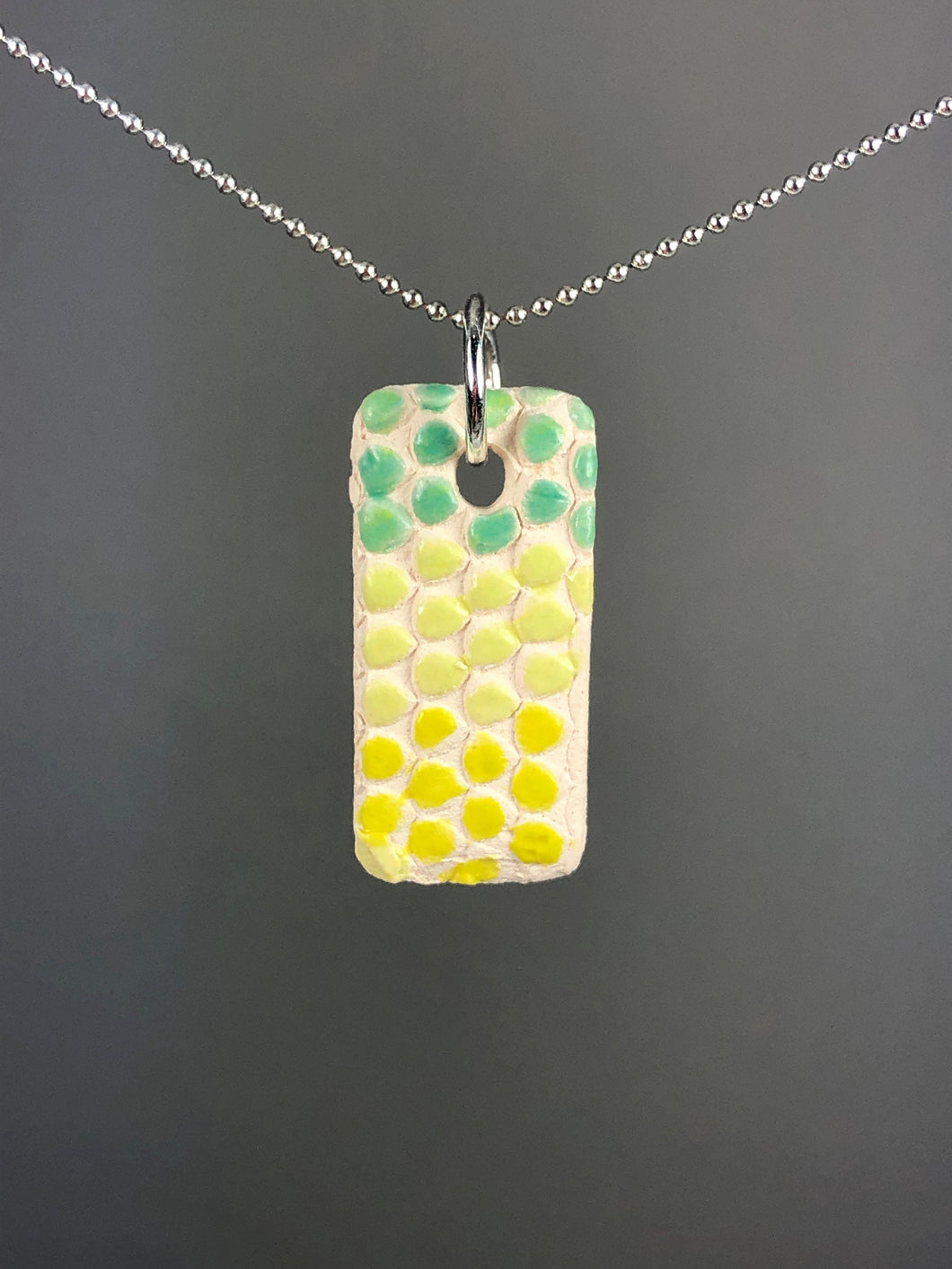 yellow and green on white pendant